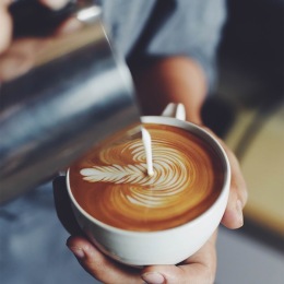 a person pouring coffee