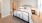 a bedroom with a bed and lamps