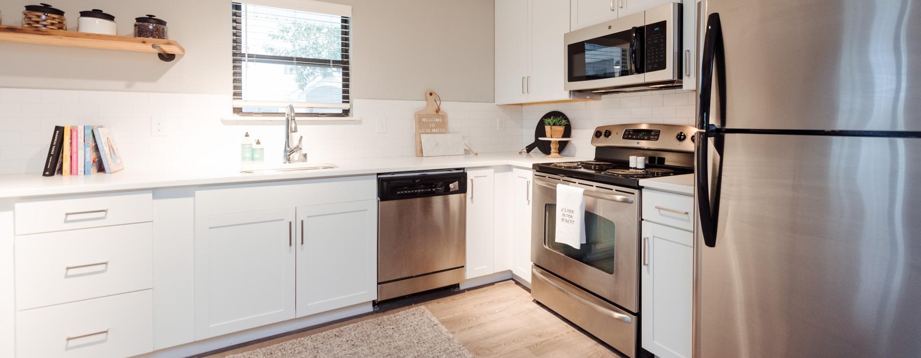 a kitchen with white cabinets
