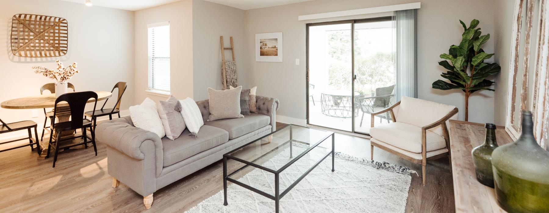 a living room with a couch and chairs
